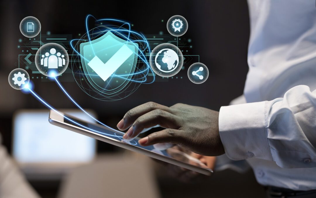 A man holding a tablet with a security shield on it.